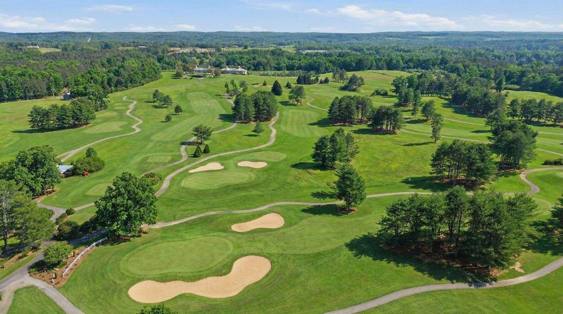Aerial view of Apple Mountain Golf Club fairway with North Georgia mountains