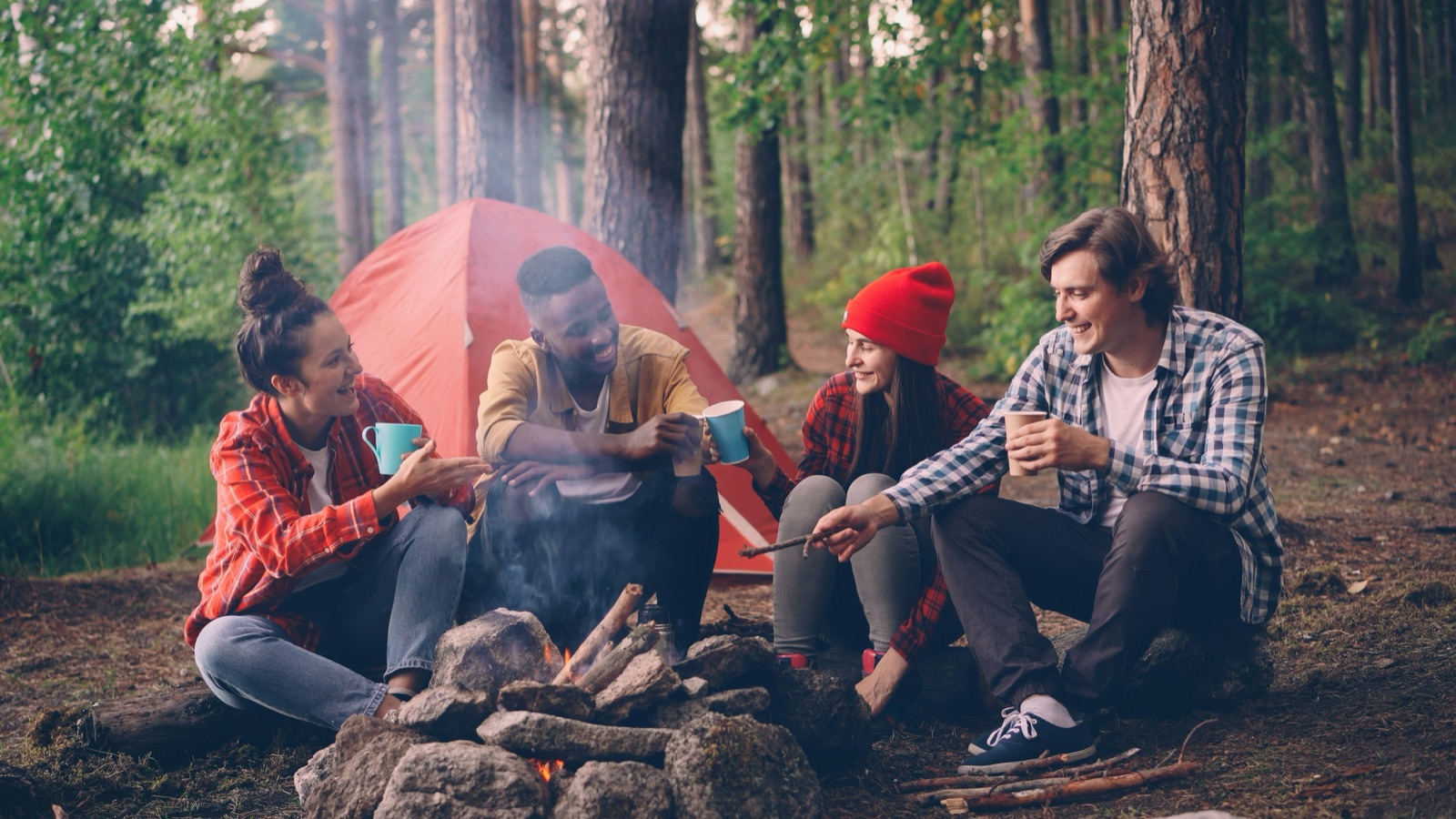 Group gathered around a campfire at Apple Mountain retreat