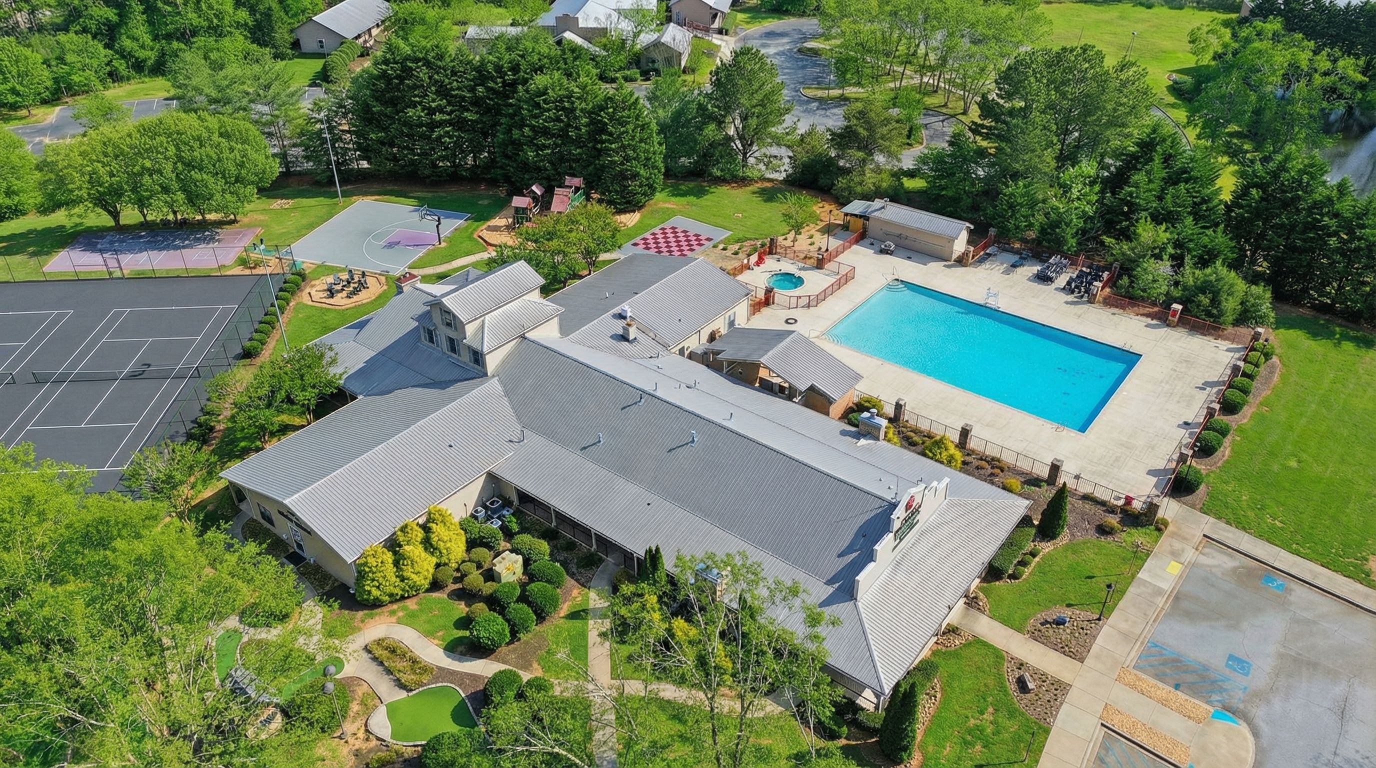 Aerial view of Apple Mountain Resort amenity complex with pool and tennis courts