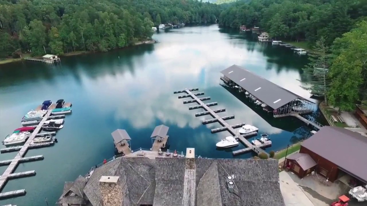 Aerial view of Lake Burton marina with boats and forested shoreline