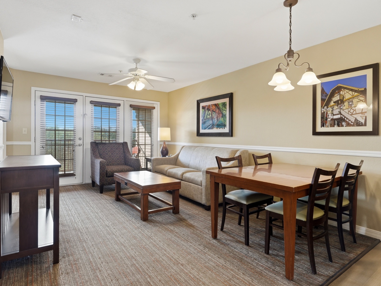 Cabin Residence living and dining area with patio doors